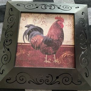Metal frame rooster wall hanging. Great for kitchen decor.